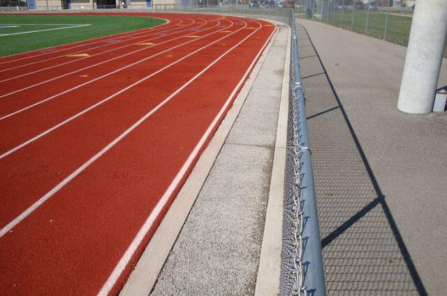 concrete path near running track
