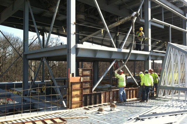 workers pouring concrete